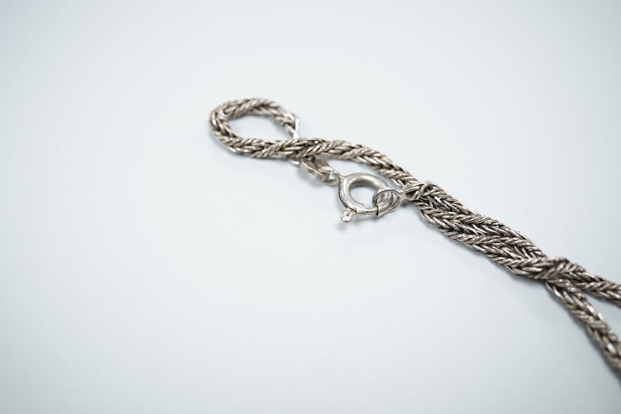 Michael Allen Bolton, a silver cross pendant and a pair of earrings, comprising: a cross pendant of textured design, length 5.1cm, British hallmarks for silver, sponsor's mark MAB, date letter for 1977, on a silver chain